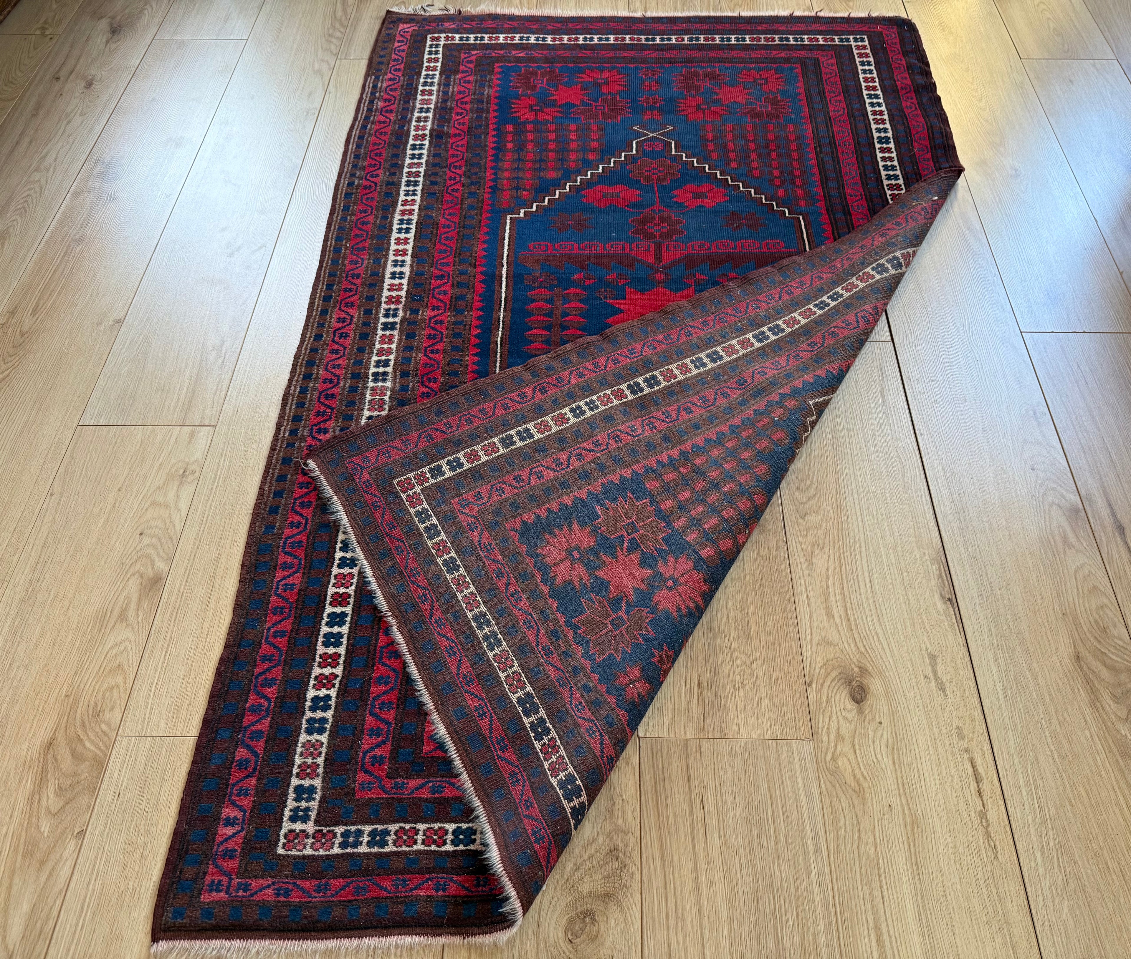 Hand-knotted tribal vintage carpet – Baluch – Indigo & star medallion – ca. 1920–1935 size: 177 × 108 cm