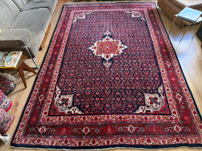 Groot handgeknoopt vintage tapijt – donkerblauw veld met medaillon – 305 × 209 cm